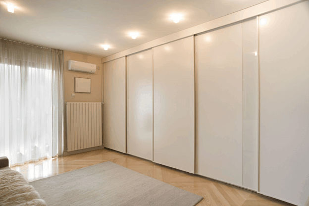 Room with split type aircon and sliding closet doors