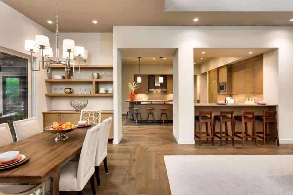 Luxury Dining Room and Kitchen Interior. Beautiful kitchen, bar seating and hardwood flooring